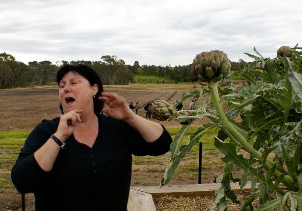 Chef Genevieve Harris talks artichokes in the restaurant garden. 